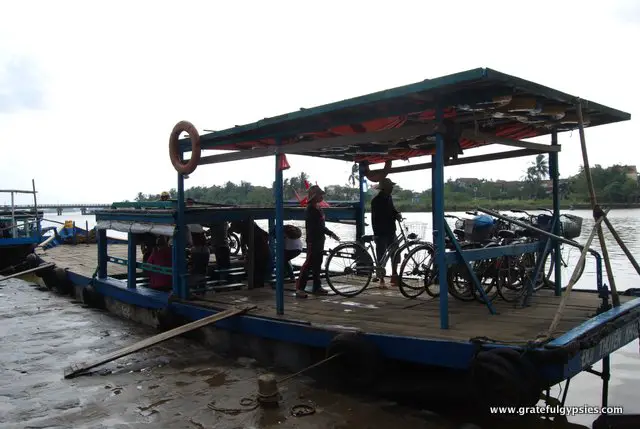 Taking the ferry with bikes across to the small island.
