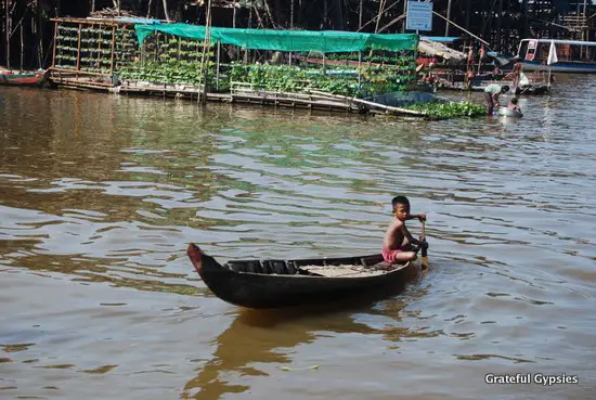 A boy moving around the floating village.