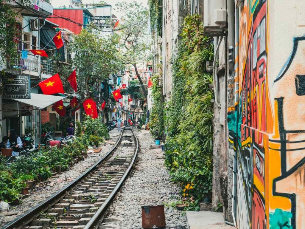 An image of train tracks running through a town in Vietnam